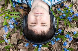 Man in headphones. Flowers